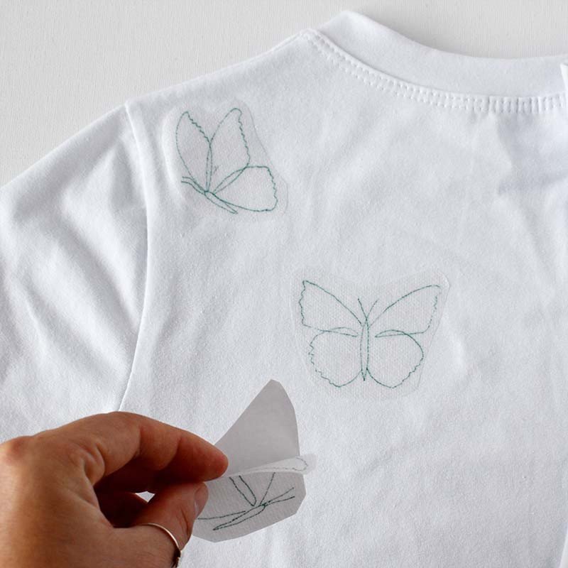 Cut Out A Butterfly Shape And Paste It On A T-shirt.